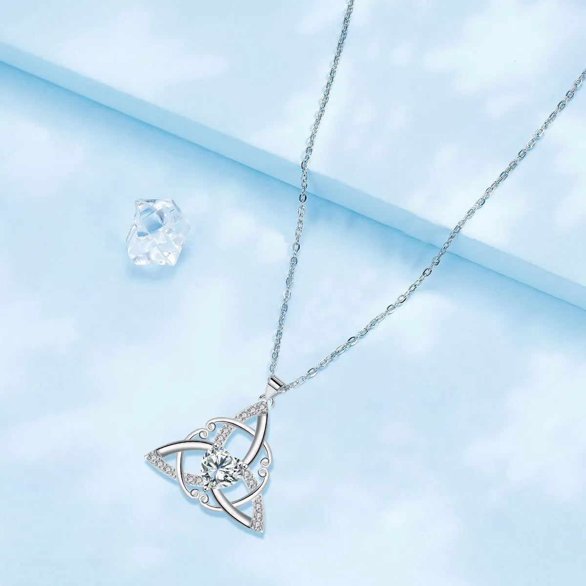 Sterling silver plated Celtic knot necklace for women with geometric pendant, available in four crystal colours.