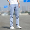 Men's smoky gray straight leg jeans with low waist and zipper fly closure