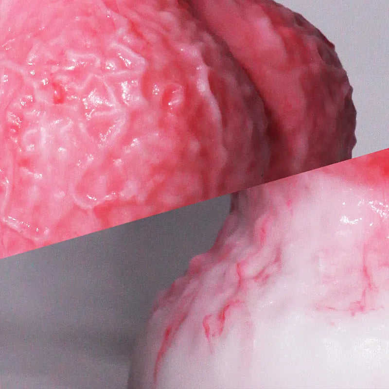 Pink penis-shaped silicone masturbation device for women