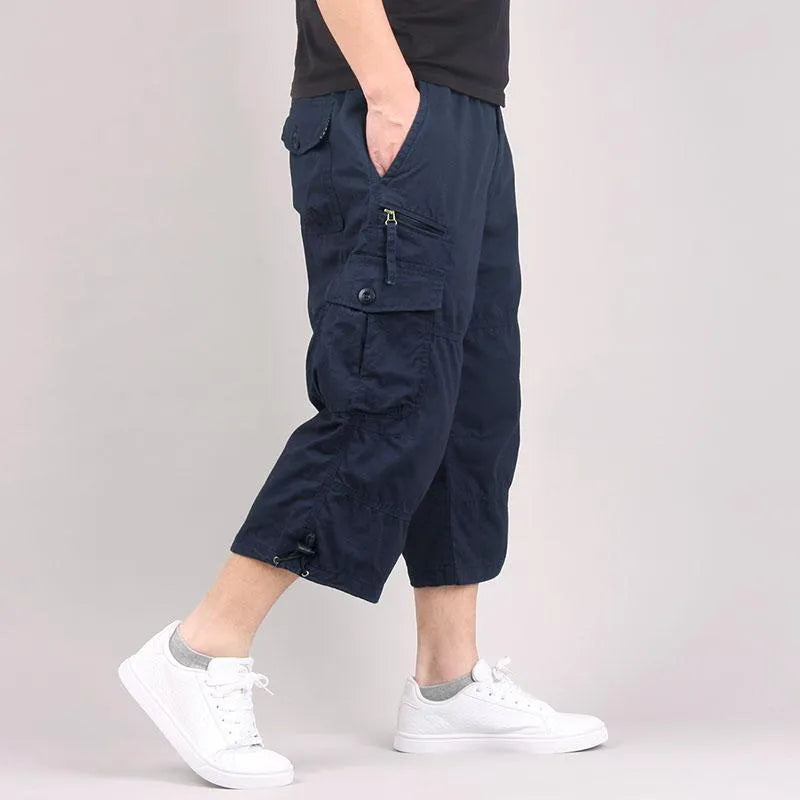 Man wearing loose-fitting khaki cotton cropped casual pants for sports.