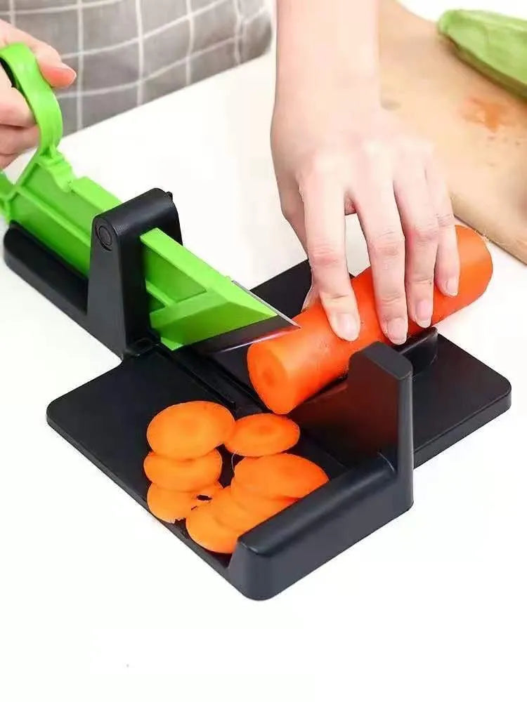 Green and red modern vegetable cutter with stainless steel blades for slicing carrots and potatoes
