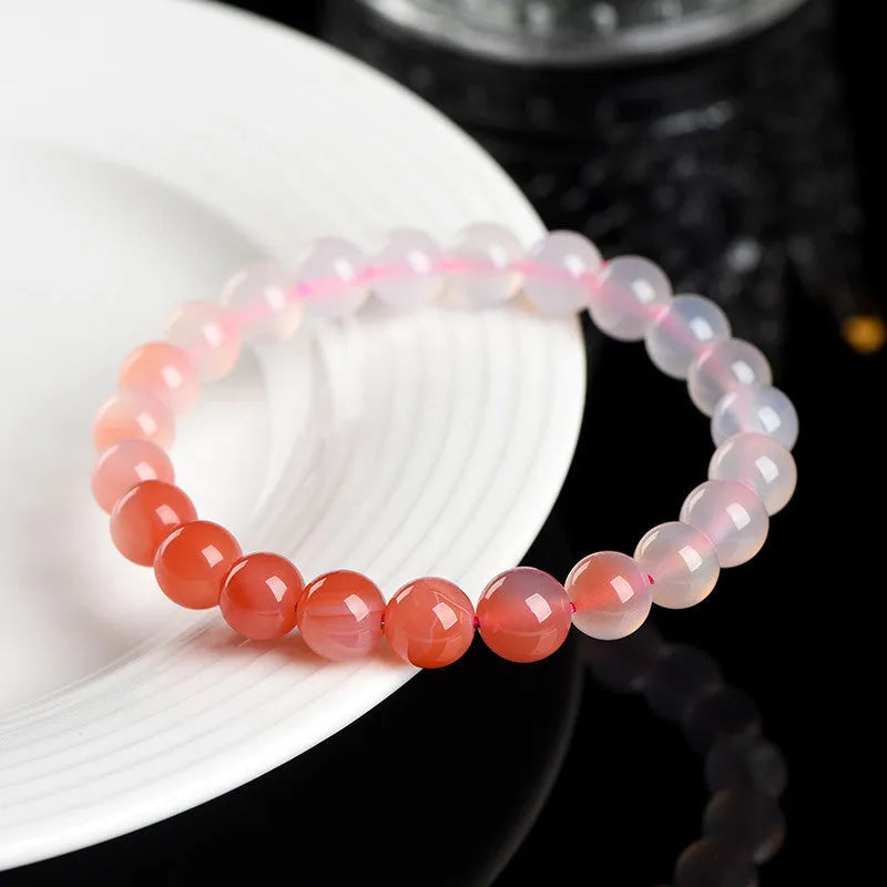 Natural gradient Yanyuan agate bracelet showing colour variation on geometric beads in single circle design