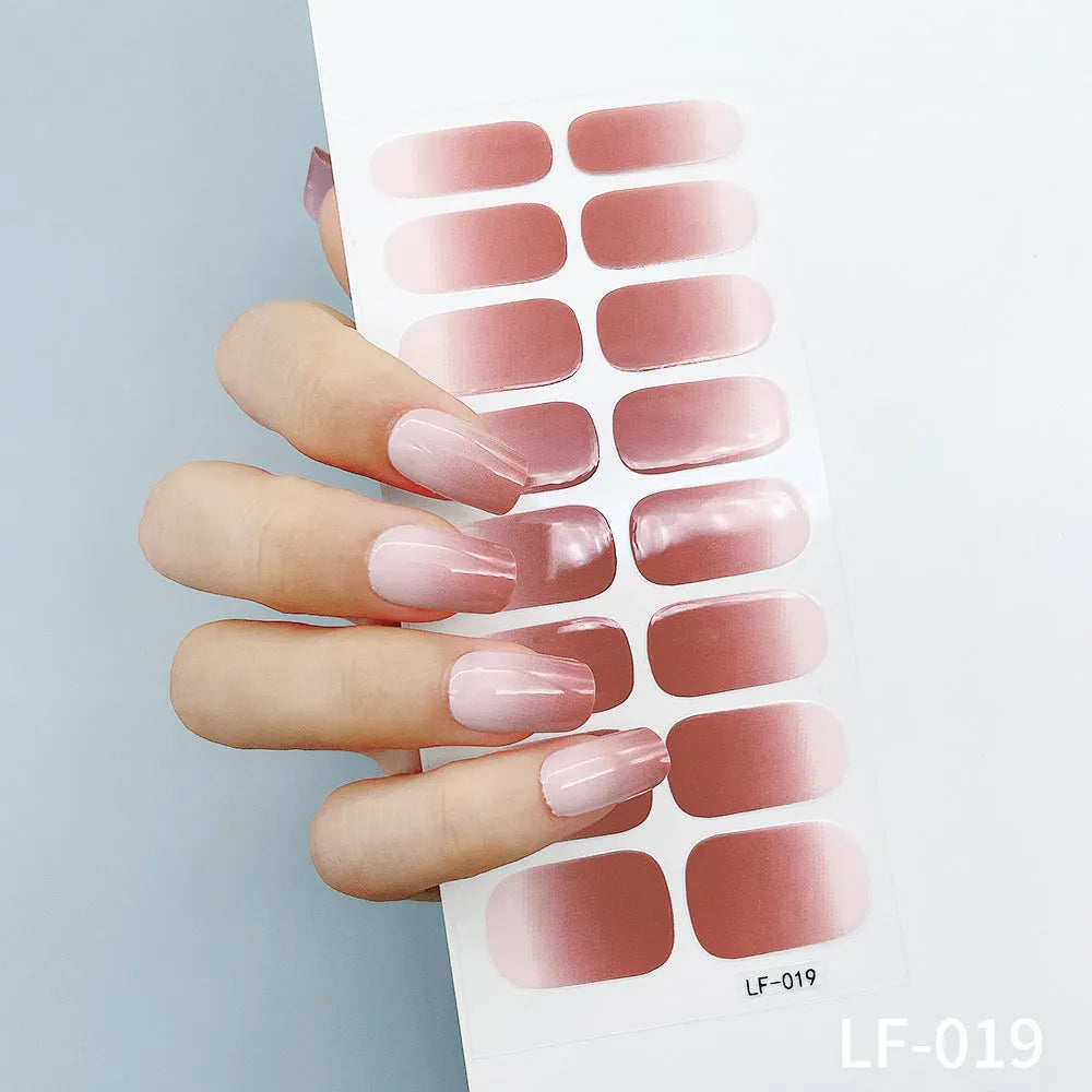Full coverage nail art stickers sheet with 16 designs including cross, rose, tulip, and cartoon patterns.