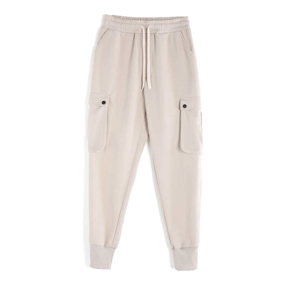 Men's loose ankle-tied cotton sports trousers in multi-pocket design showing apricot colour option