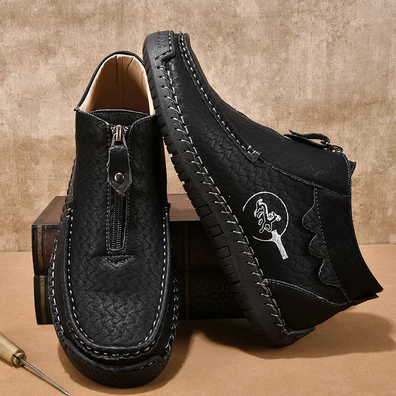 Men's black slip-on casual loafers with round toe and rubber sole.