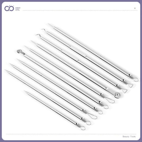 Four silver metal acne needles with ultra-fine pointed tips for skincare treatment.