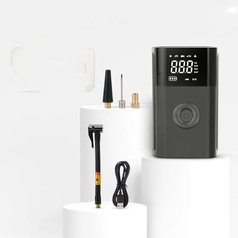 Black handheld wireless digital air pump with LCD screen and LED light, with assorted inflation nozzles