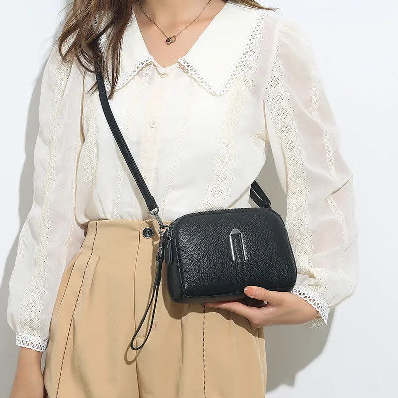 Women's genuine leather square shoulder bag in black with first layer cowhide construction measuring 19x13x6cm
