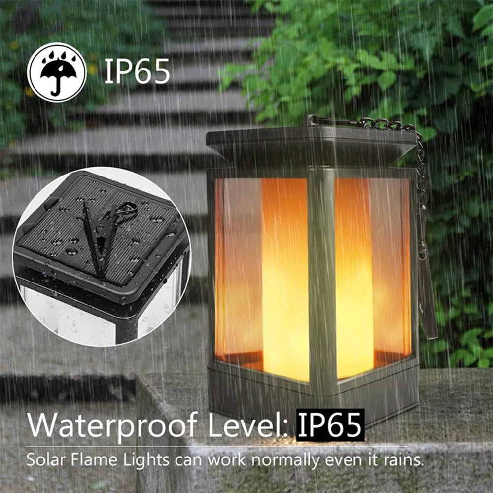 Black antique flame style outdoor solar LED street lamp on a post.