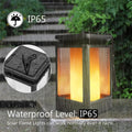 Black antique flame style outdoor solar LED street lamp on a post.