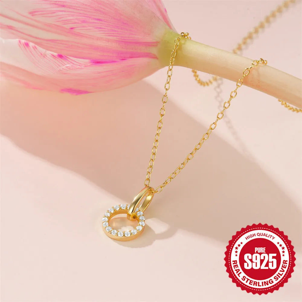 Gold tone S925 sterling silver clavicle chain with geometric interlocking zircon pendant.
