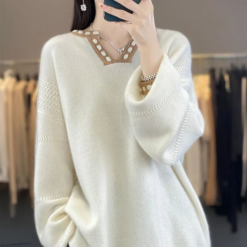 Women's camel coloured V-neck long sleeve viscose pullover sweater laid flat.