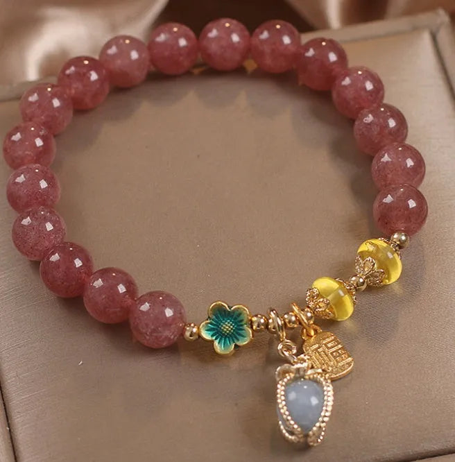 Red women's bracelet with strawberry quartz beads, alloy components, and rhinestones
