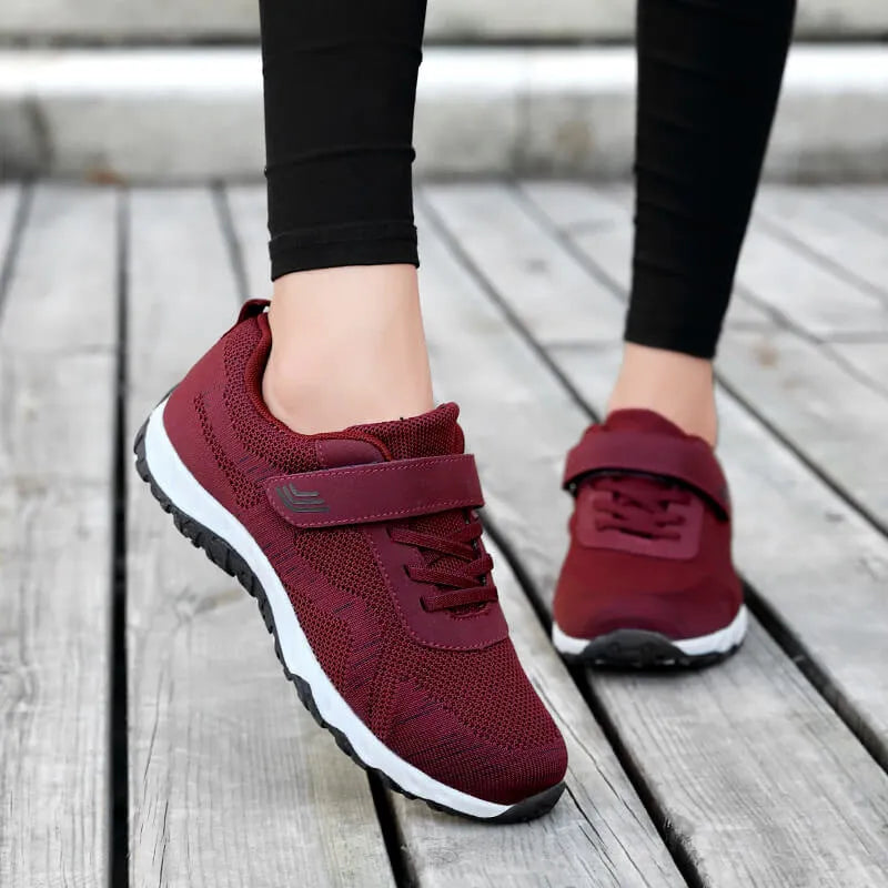 Women's low-top wedge heel shoe in mesh with Velcro strap, shown in a solid colour.