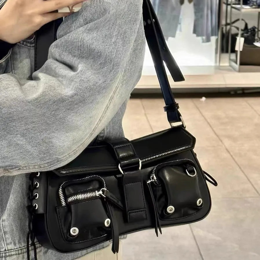 Black structured PU baguette messenger bag with a long adjustable shoulder strap.