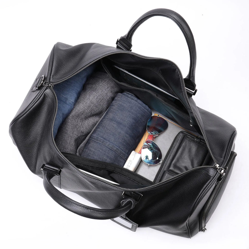 Men's black leather excursion travel bag with single shoulder strap and large capacity