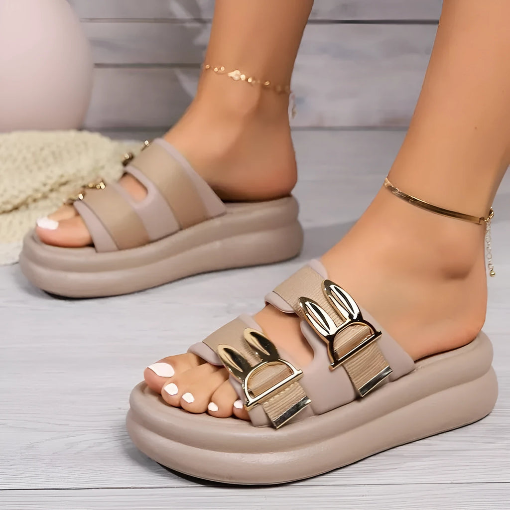 Women's apricot suede slippers with thick rubber soles shown from the side
