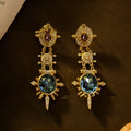 Geometric round gold-coloured stud earrings with diamond-treated alloy surface and retro elegant design