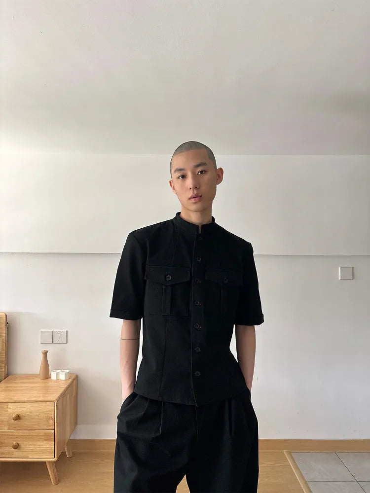 Handmade black loose fit half sleeve button-down shirt for men, shown on a hanger.