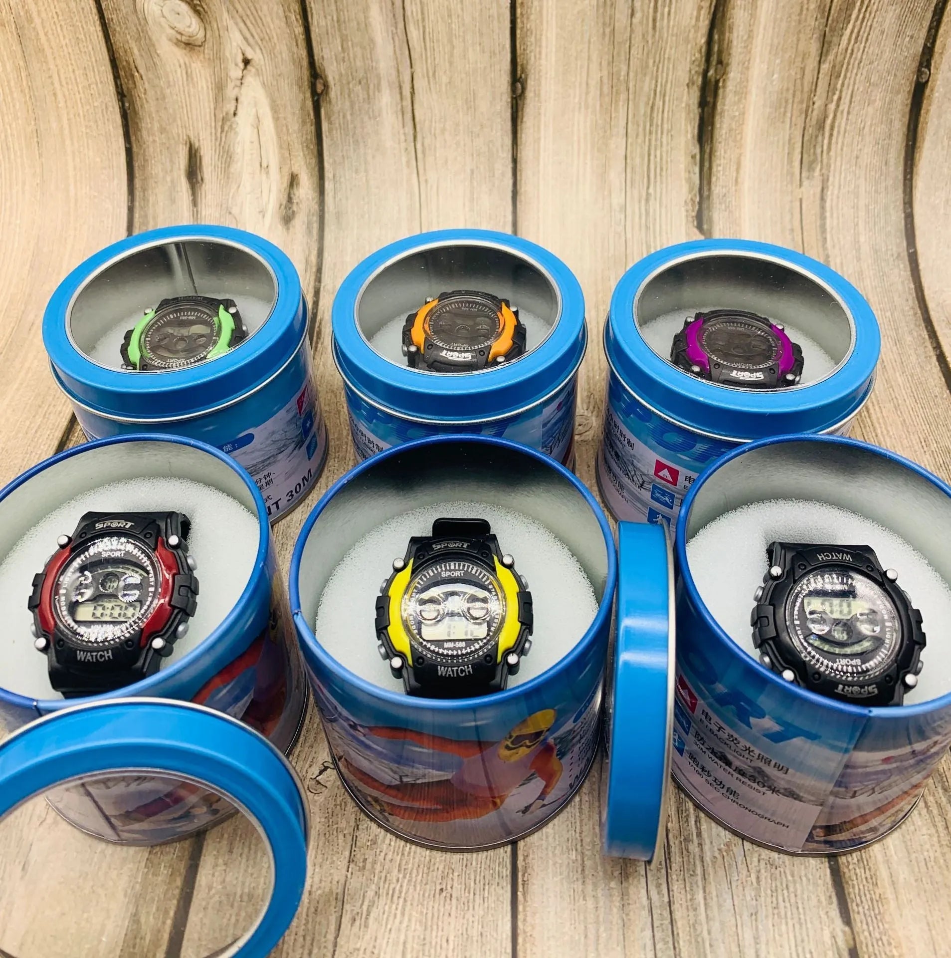 Digital sports watch for children with silicone strap and plastic case showing alarm, calendar and timer functions