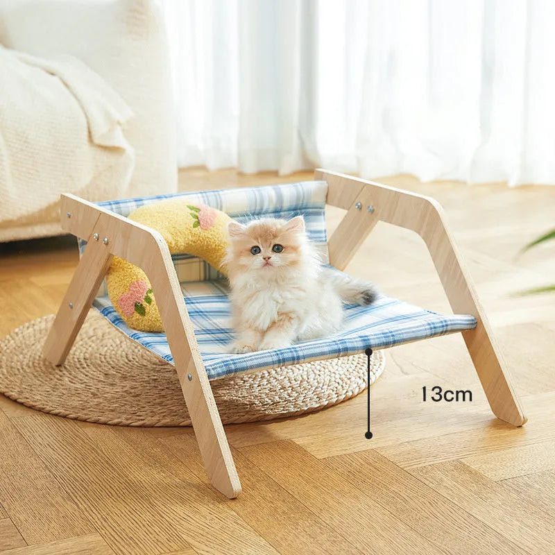 Wooden elevated cat bed with cloth hammock in beach chair design for indoor use