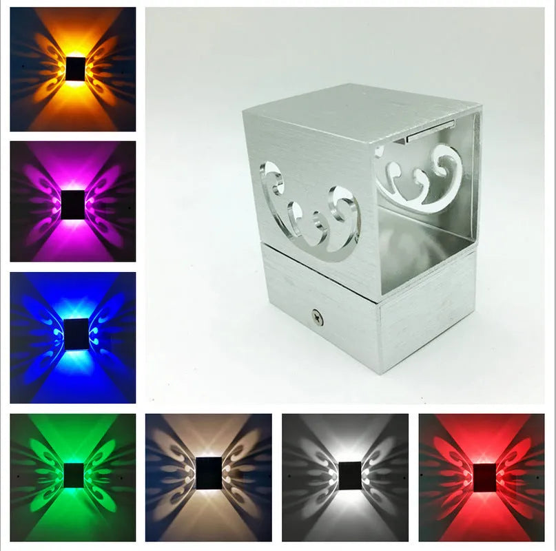Modern aluminium butterfly-shaped LED wall lamp with multi-colour remote control.