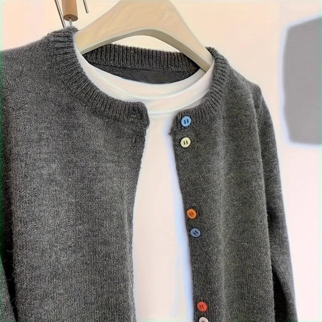 Dark grey women's cardigan sweater with button front and long sleeves.