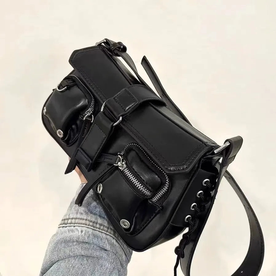Black structured PU baguette messenger bag with a long adjustable shoulder strap.