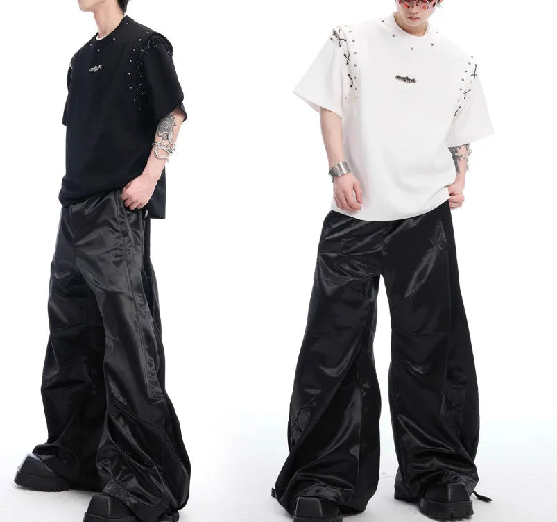 Black deconstructed lace-up cutout short sleeve t-shirt on a hanger