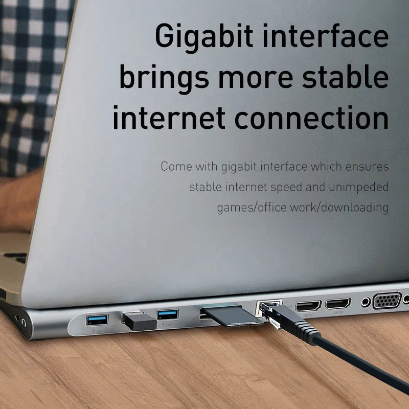 Grey aluminium alloy USB-C docking station with 10 ports and cooling bracket on desktop