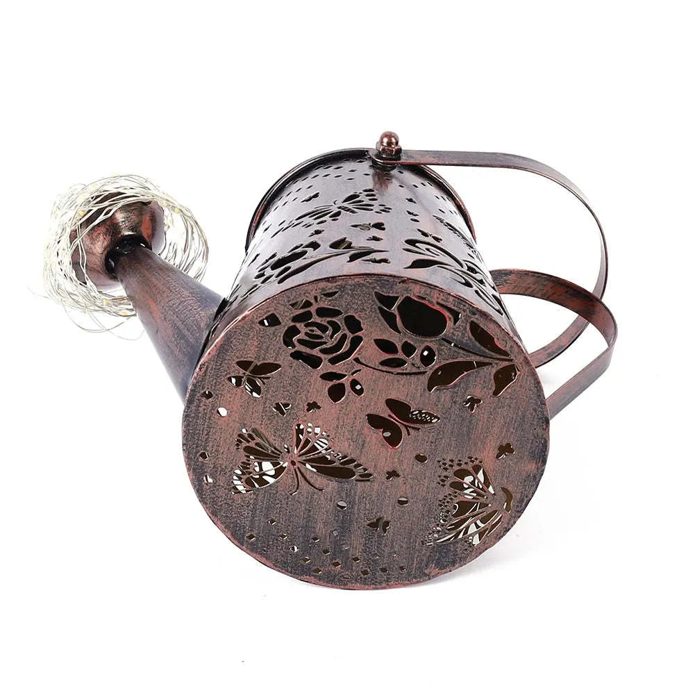 Tapered butterfly pattern iron solar garden lamp with warm white LED lighting