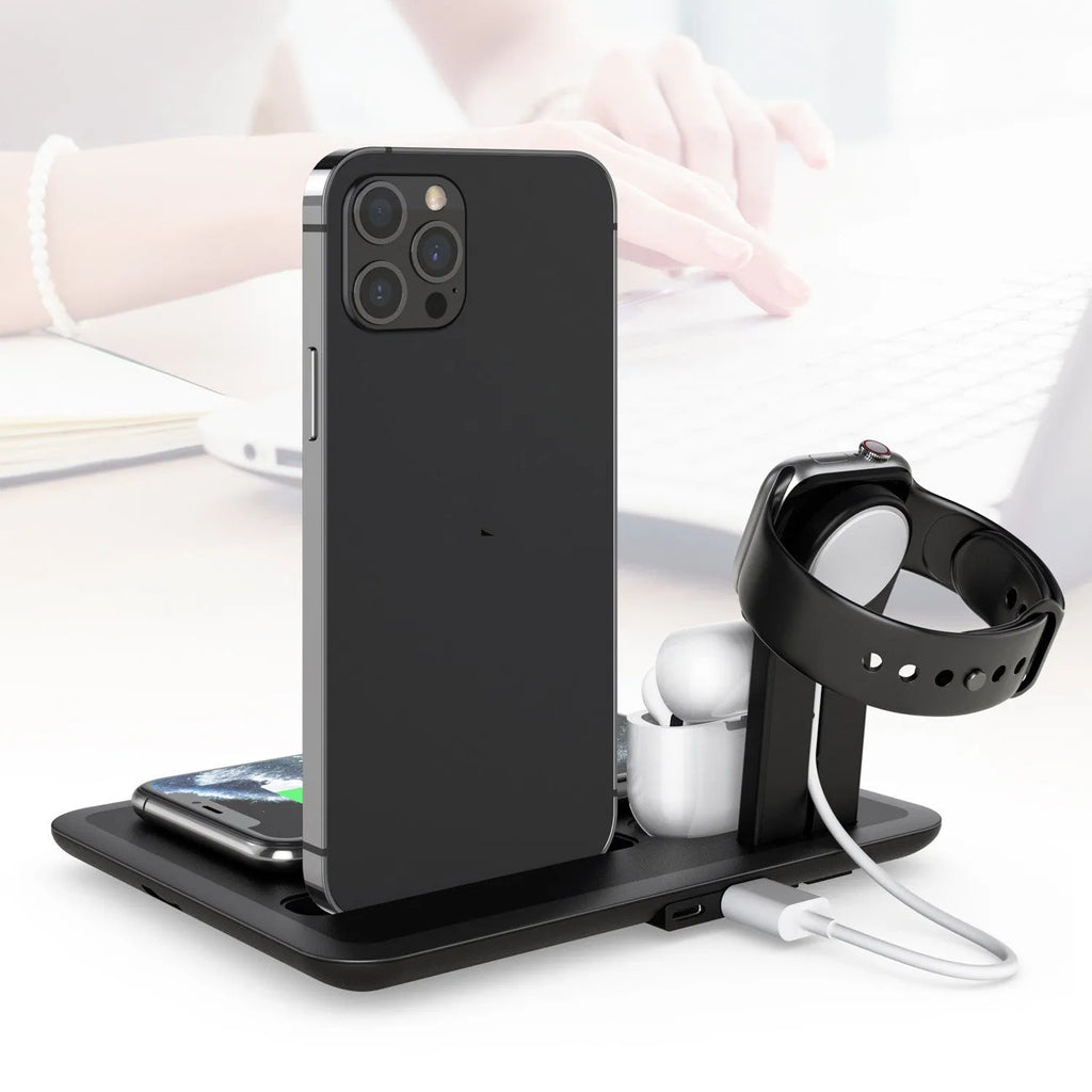 Black and white wireless charging station for phone watch headphones on desktop