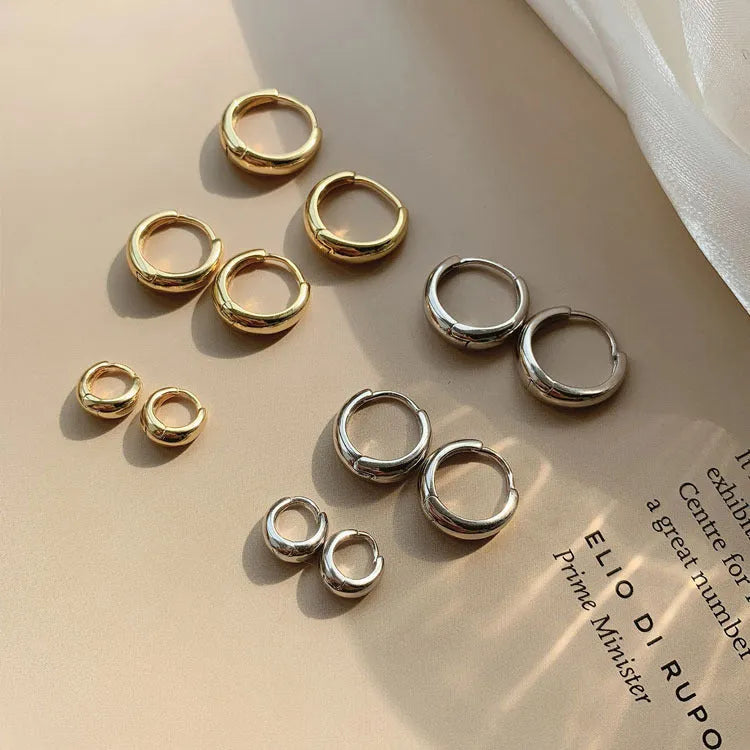 Women's geometric water drop earrings with round elements in electroplated gold or silver finish on copper