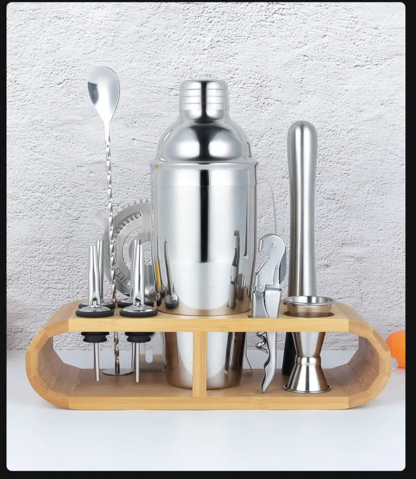 23-piece stainless steel cocktail set with acrylic European-style mixers arranged on bar surface
