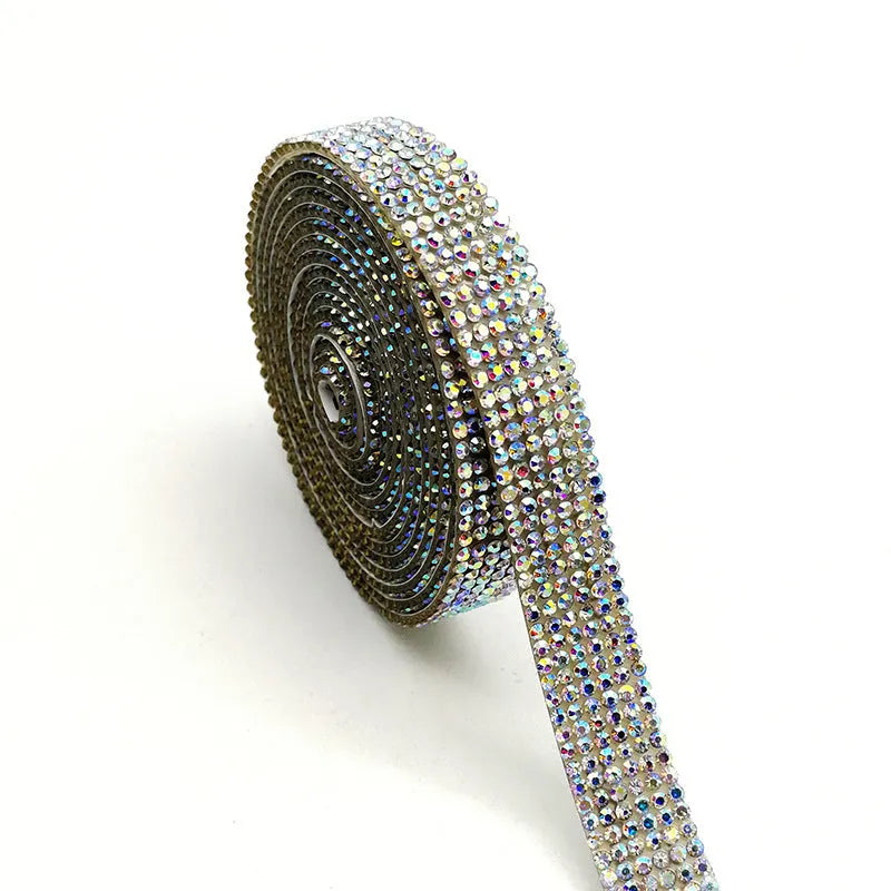 A long strip of electroplated glass self-adhesive water drill for clothing decoration in white and AB colour.