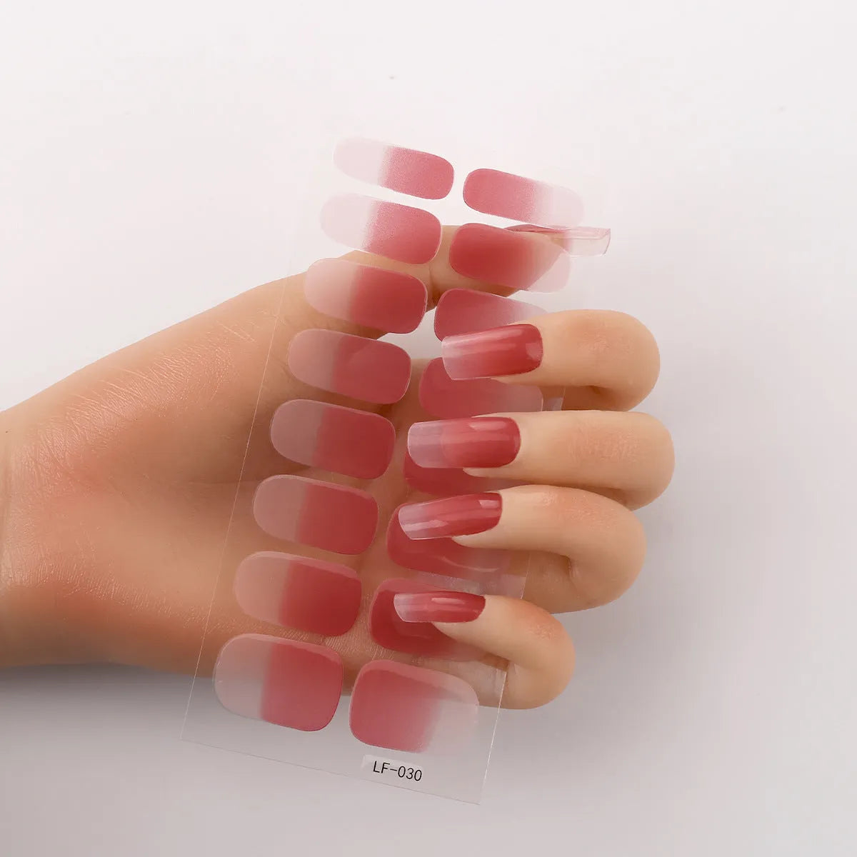 Full coverage nail art stickers sheet with 16 designs including cross, rose, tulip, and cartoon patterns.