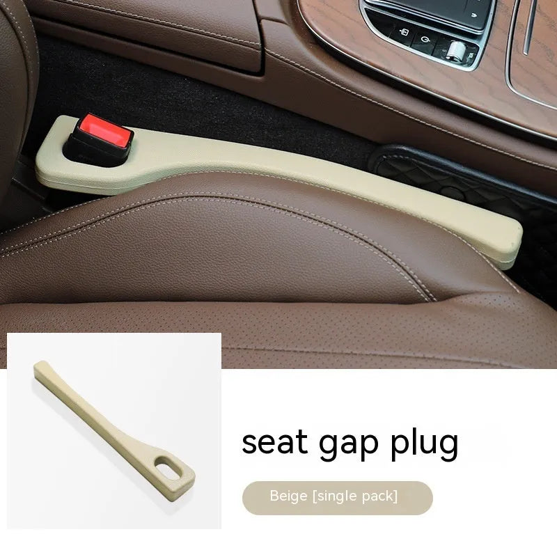 Black polyurethane car seat gap filler strip preventing items falling between vehicle seats