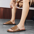 Men's brown and black leather casual sandals with rubber soles for summer outdoor wear.
