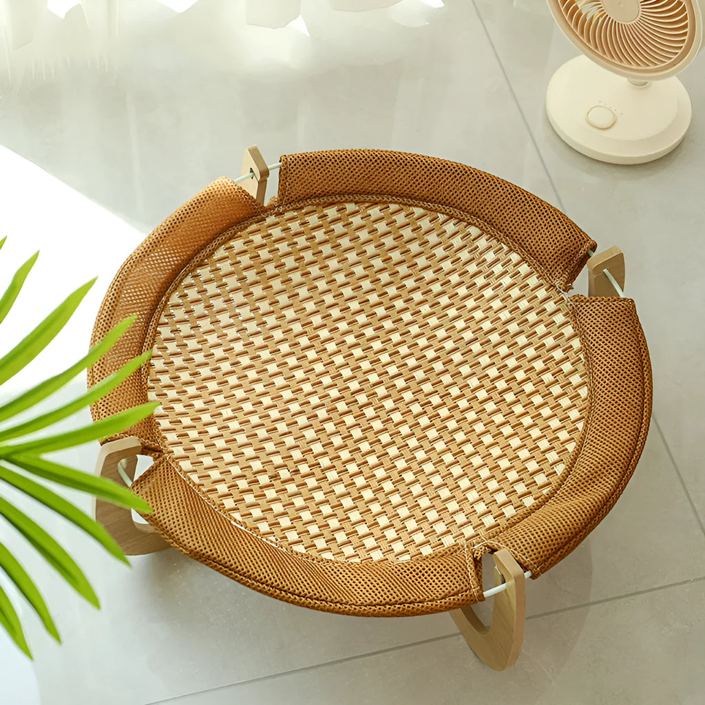 Brown woven rattan square pet hammock bed for cats and dogs, elevated off the ground.