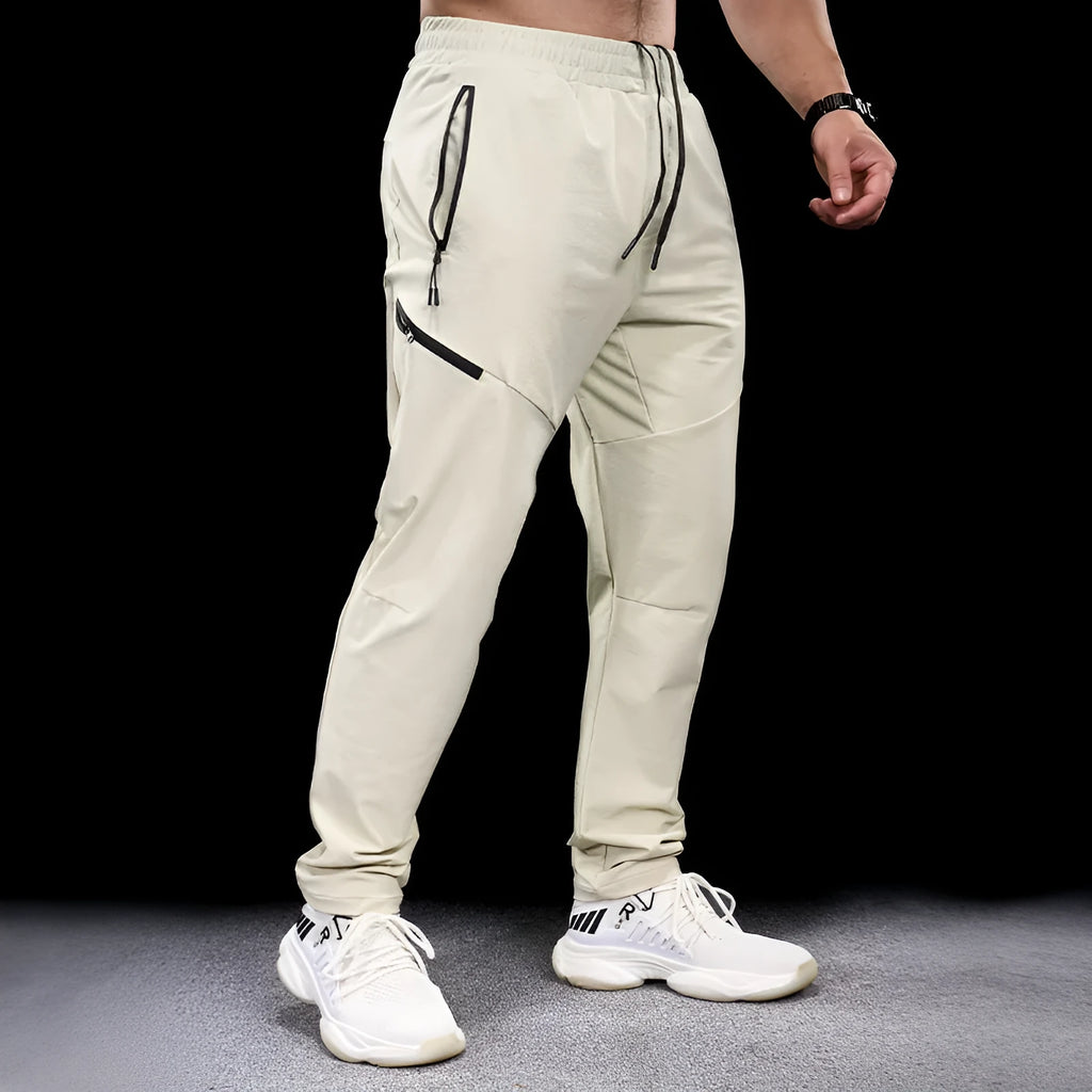Men's Army Green waterproof quick-drying nylon workout pants, trousers length with mid waist.