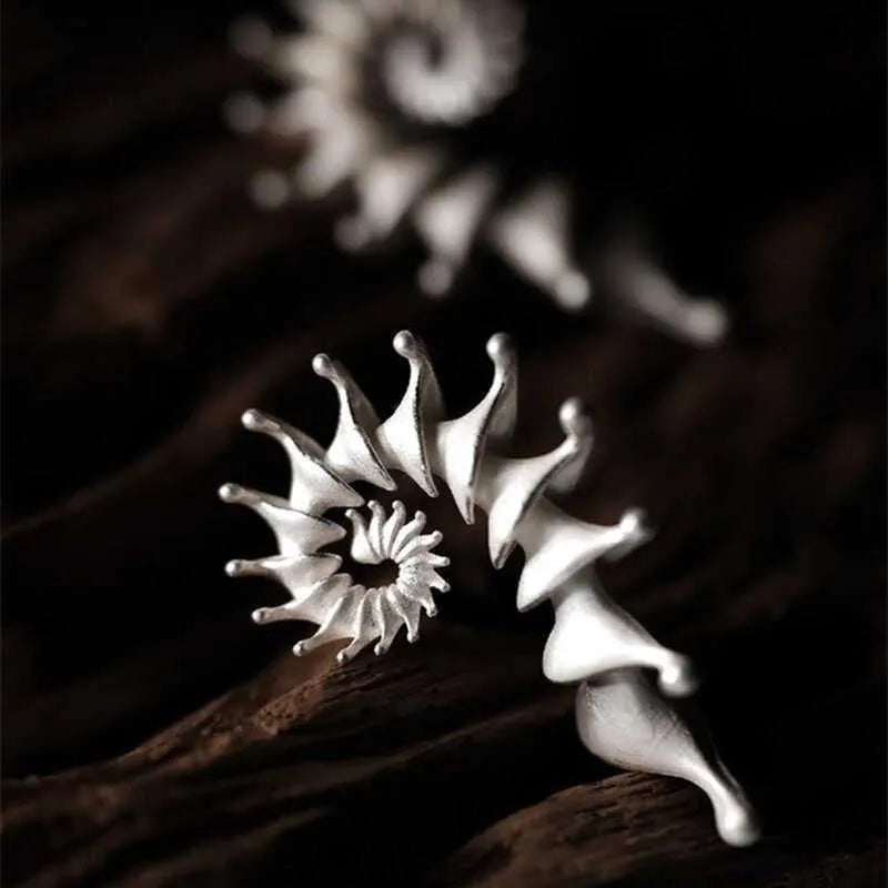 Matte finish alloy conch stud earrings with three-dimensional design and irregular shape