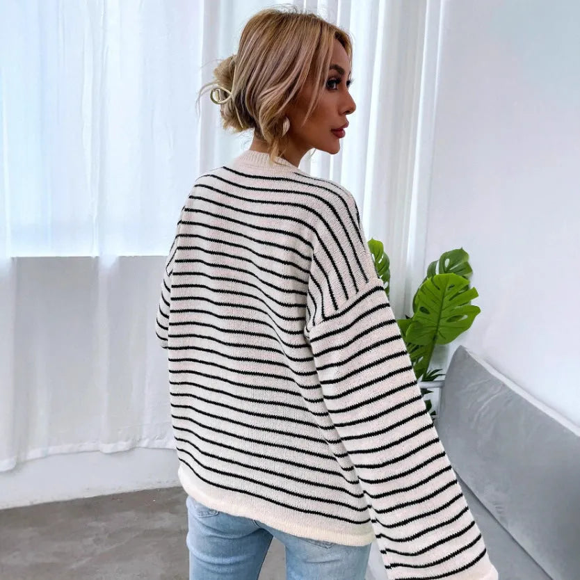 Black striped women's long sleeve top with drop shoulder design and button front
