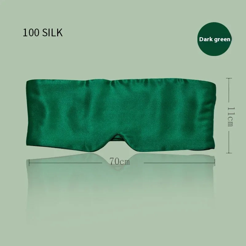 Mulberry silk sleep mask in champagne gold colour, shown folded.