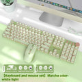 Matcha green mechanical keyboard with white backlight, aluminium panel, and multi-function knob on a desk