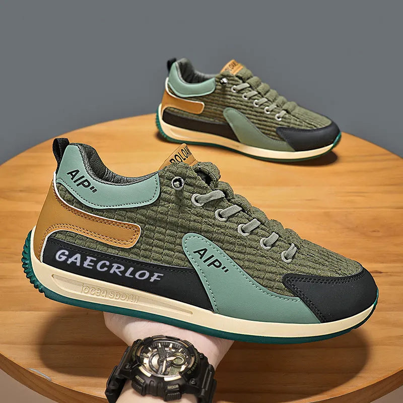 Men's grey and green mesh running shoes with lace-up front and low-top design