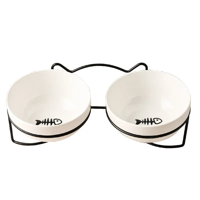 White ceramic cat bowl with cat paw design in black iron frame
