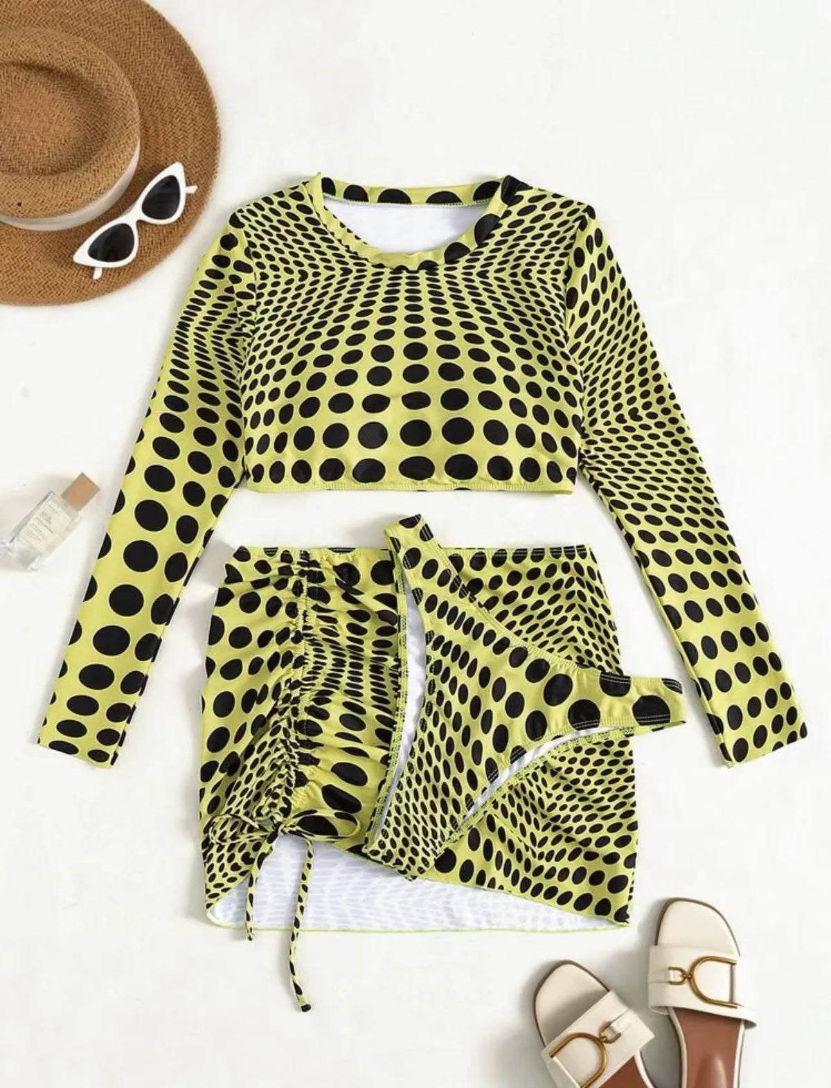 Women's green and yellow polka dot polyester swimsuit three-piece set showing top, skirt, and bra.