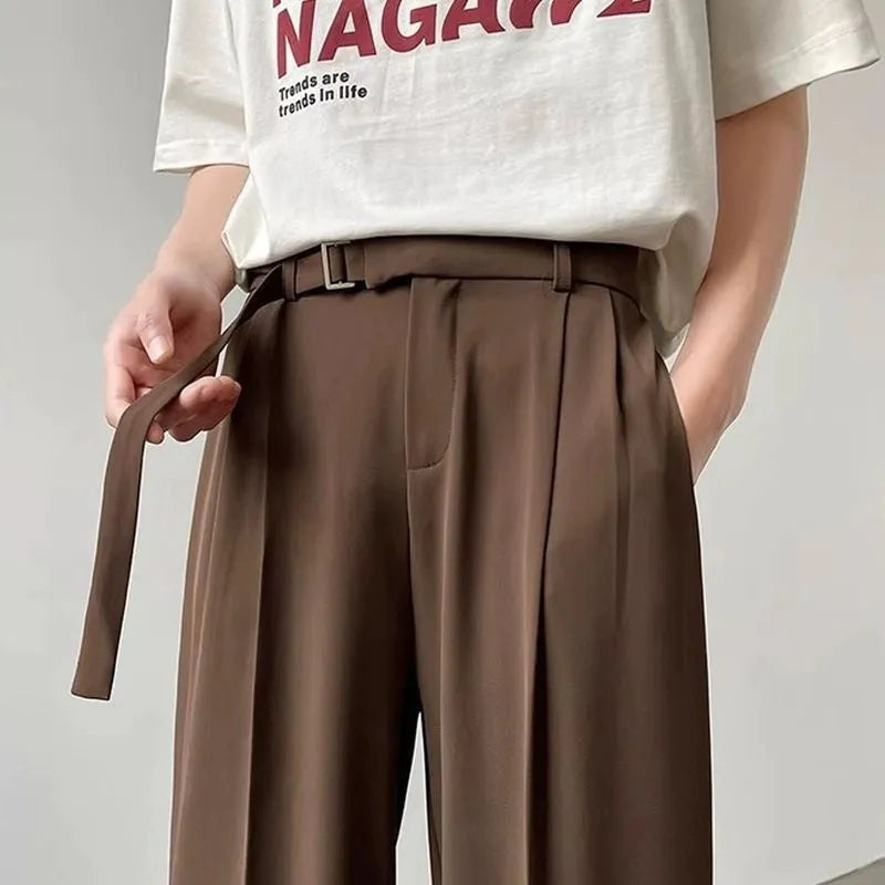 Black thin straight wide leg casual trousers with a loose fit and straight leg opening.