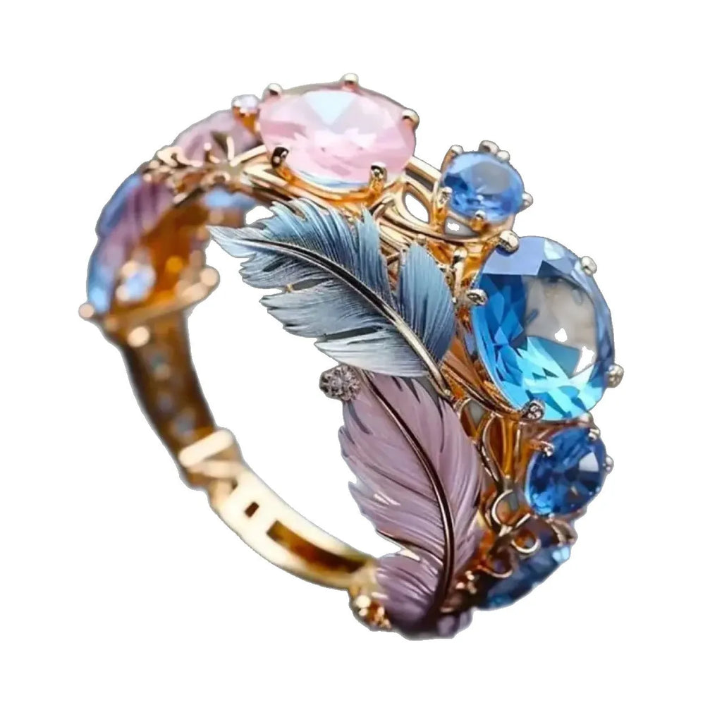 Gold colour brass ring with embossed colourful feather design and zircon stone inlay