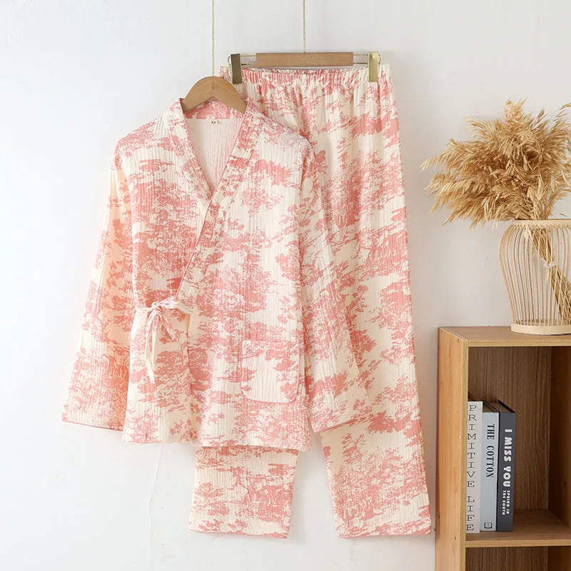 Women's pink cotton gauze lounge suit two-piece set with lace-up front trousers detail.